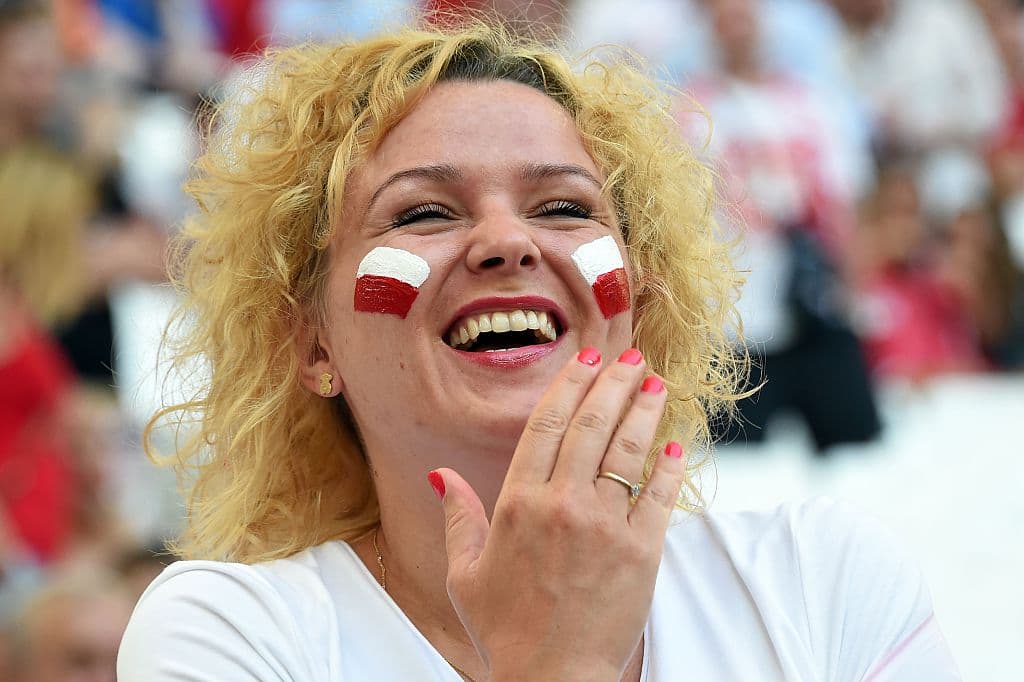 A Poland supporter laughs prior to the Euro 2016 quarter-final football match between Poland and Portugal at the Stade Velodrome in Marseille on June 30, 2016. / AFP / Anne-Christine POUJOULAT (Photo credit should read ANNE-CHRISTINE POUJOULAT/AFP/Getty Images)