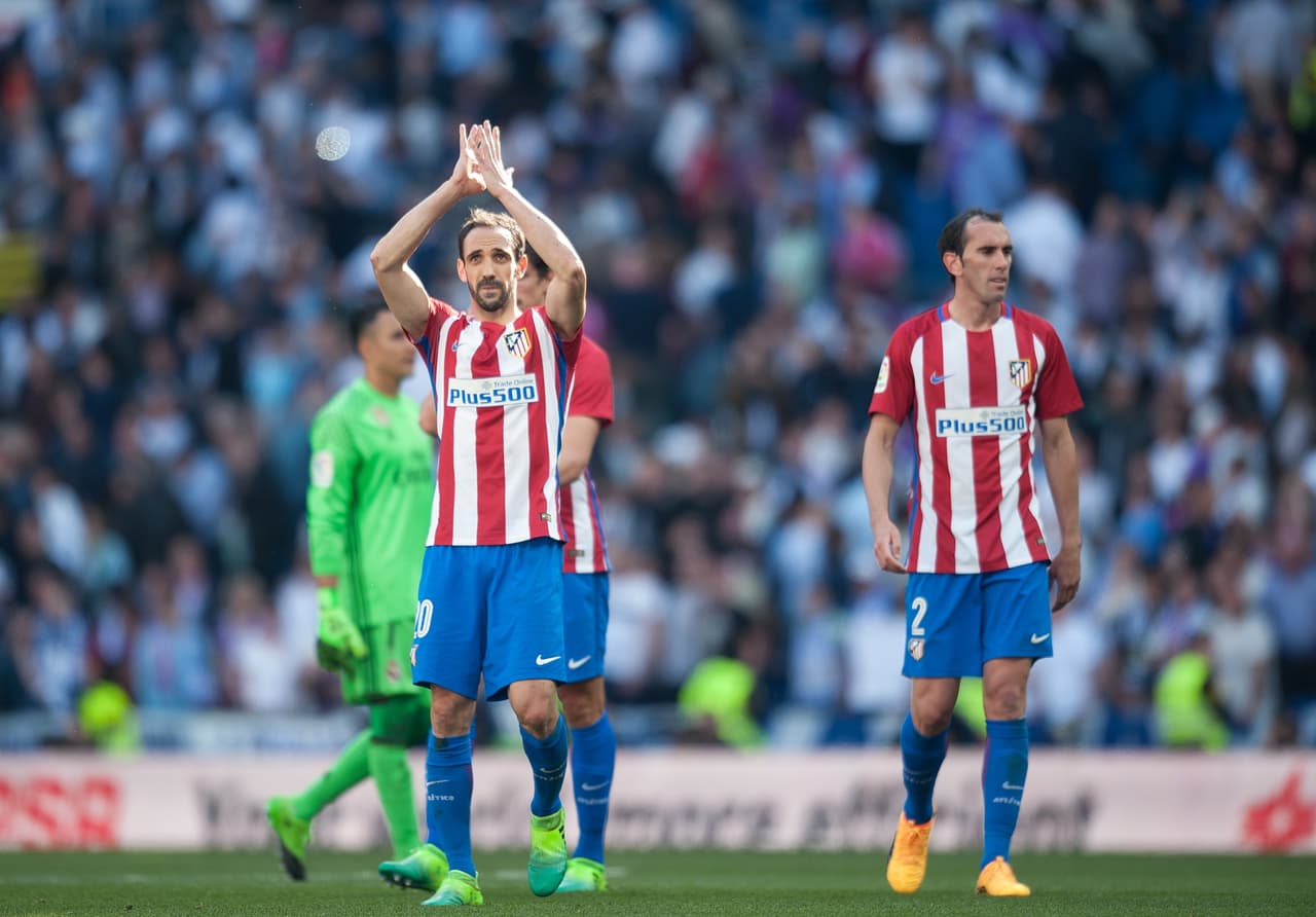 MADRID, SPAIN - APRIL 08: Juanfran of Club Atletico de Madrid celebrates with teamates at the end of the La Liga match between Real Madrid CF and Club Atletico de Madrid at Bernabeu on April 8, 2017 in Madrid, Spain. (Photo by Denis Doyle/Getty Images)
