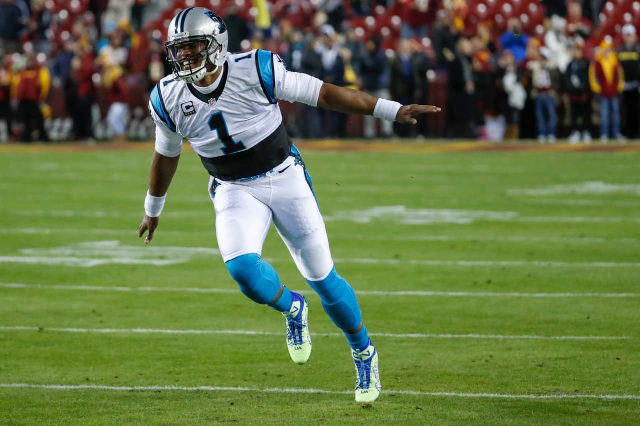 Carolina Panthers quarterback Cam Newton (1) runs across the field before an NFL football game against the Washington Redskins in Landover, Md., Monday, Dec. 19, 2016. (AP Photo/Alex Brandon)