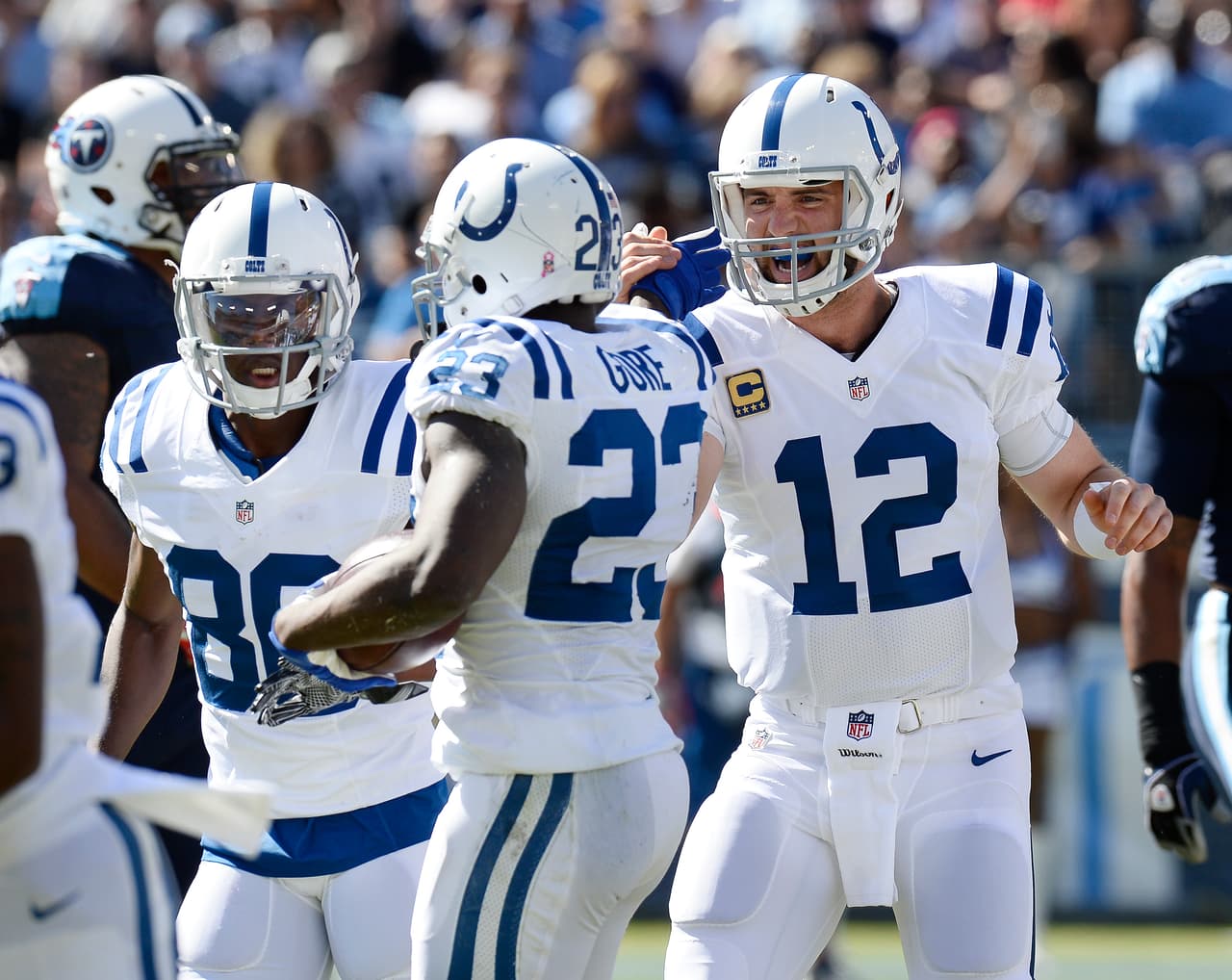 Indianapolis Colts quarterback Andrew Luck (12) celebrates with running back Frank Gore (23) after Gore scored a touchdown on a 3-yard pass reception against the Tennessee Titans in the first half of an NFL football game Sunday, Oct. 23, 2016, in Nashville, Tenn. (AP Photo/Mark Zaleski)