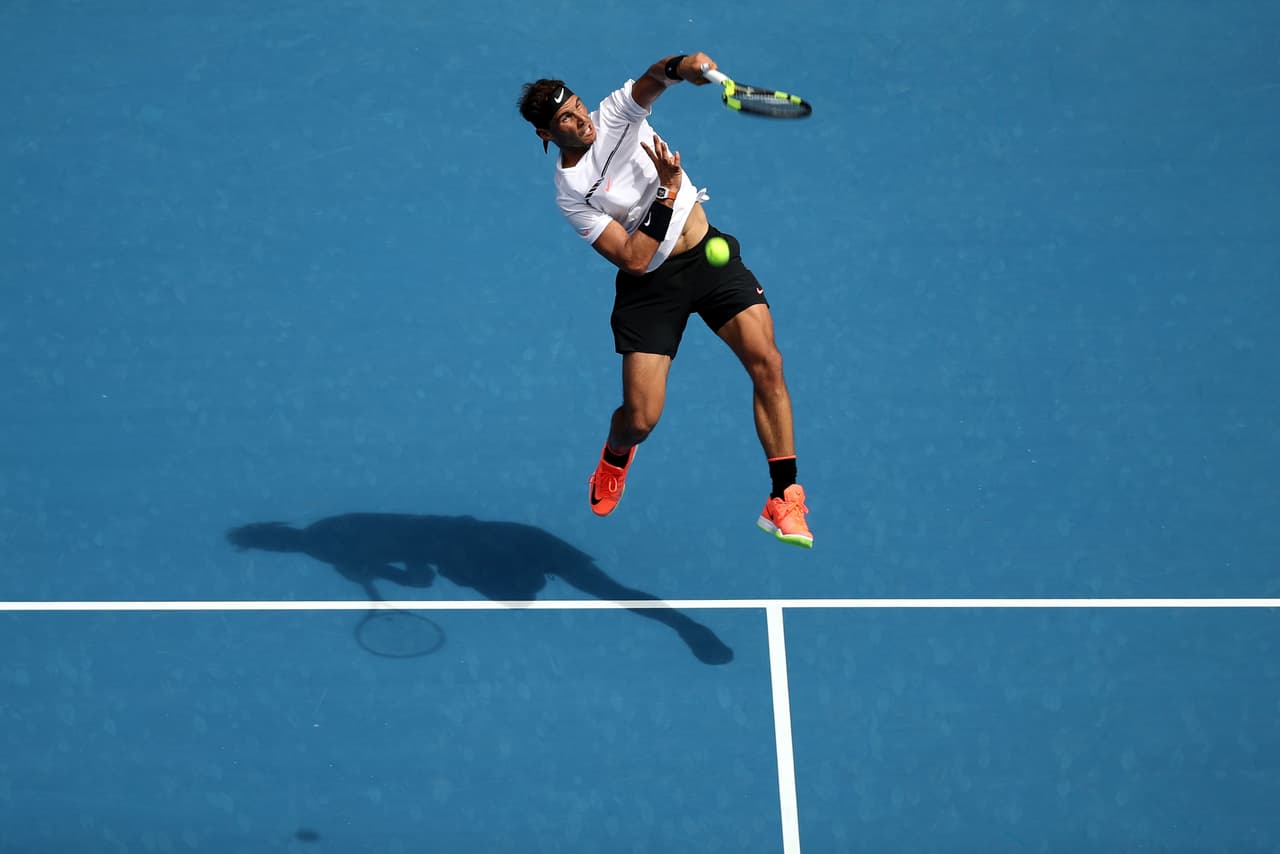 MELBOURNE, AUSTRALIA - JANUARY 17: Rafael Nadal of Spain plays a forehand smash in his first round match against Florian Mayer of Germany on day two of the 2017 Australian Open at Melbourne Park on January 17, 2017 in Melbourne, Australia. (Photo by Mark Kolbe/Getty Images)