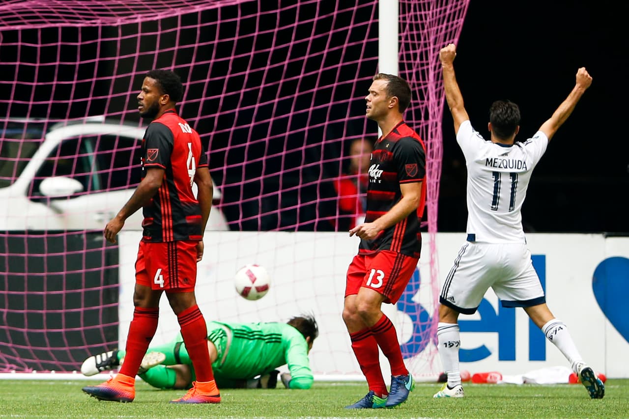 Oct 23, 2016; Vancouver, British Columbia, CAN; Portland Timbers defender Jermaine Taylor (4), forward Jack Jewsbury (13) and Vancouver Whitecaps FC forward Nicolas Mezquida (11) react after a goal scored by forward Giles Barnes (28, not pictured during the first half at BC Place. Mandatory Credit: Joe Nicholson-USA TODAY Sports