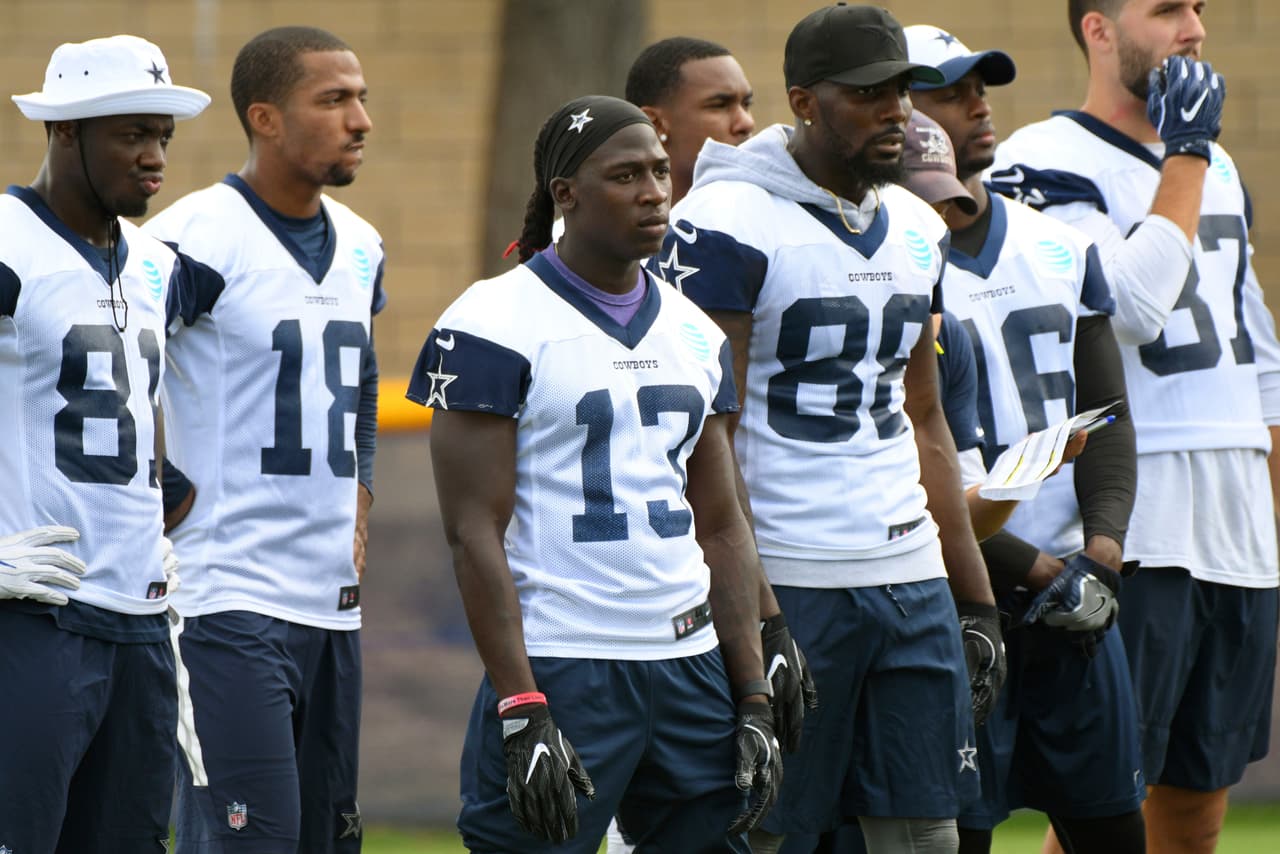 Dallas Cowboys wide receiver Lucky Whitehead (13) stands with fellow receivers during practice at the NFL football team's training camp in Oxnard, Calif., Monday, July 24, 2017. (AP Photo/Michael Owen Baker)